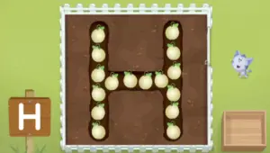 top down view of a plot of dirt with the letter H dug out, with honeydew melons growing inside the letter.